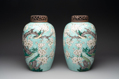 A pair of fine Chinese famille verte turquoise-ground 'magpie and prunus' jars with reticulated wooden covers, 19th C.