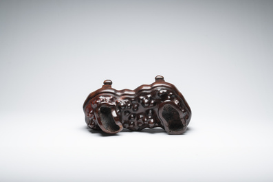 A large Chinese Lingbi stone scholar's rock on wooden stand, 19/20th C.