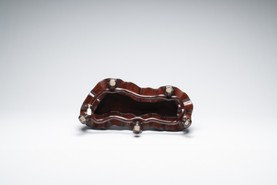 A large Chinese Lingbi stone scholar's rock on wooden stand, 19/20th C.