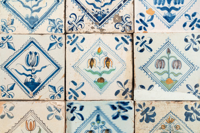 40 Dutch Delft blue, white and polychrome 'diamond' tiles with flowers, 17/18th C.