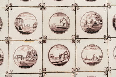 110 manganese Dutch Delft tiles with landscape medallions, 19th C.