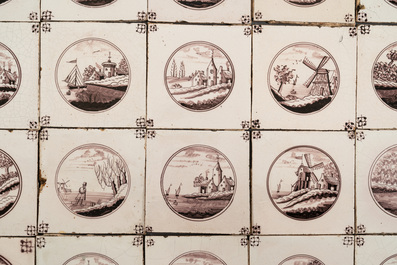 110 manganese Dutch Delft tiles with landscape medallions, 19th C.