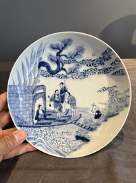 A Chinese blue and white plate with a breastfeeding woman and fishermen on boats, Yongzheng