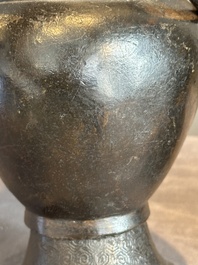 A pair of Chinese bronze vases with 'dragon' handles, Yuan/Ming
