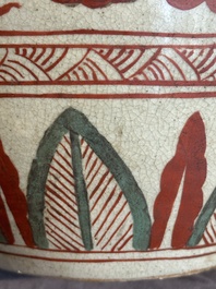 A Chinese Swatow green- and red-enamelled 'dragon' jar and a pair of covered bowls, Ming