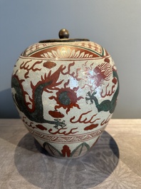 A Chinese Swatow green- and red-enamelled 'dragon' jar and a pair of covered bowls, Ming