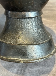 A pair of Chinese bronze vases with 'dragon' handles, Yuan/Ming