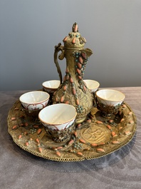 An Ottoman coral-and-turquoise-inlaid gilt-copper tea service with five Chinese wucai cups, 19th C.