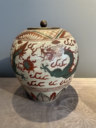 A Chinese Swatow green- and red-enamelled 'dragon' jar and a pair of covered bowls, Ming
