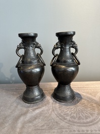 A pair of Chinese bronze vases with 'dragon' handles, Yuan/Ming