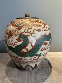 A Chinese Swatow green- and red-enamelled 'dragon' jar and a pair of covered bowls, Ming