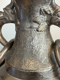A pair of Chinese bronze vases with 'dragon' handles, Yuan/Ming