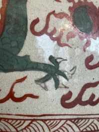 A Chinese Swatow green- and red-enamelled 'dragon' jar and a pair of covered bowls, Ming