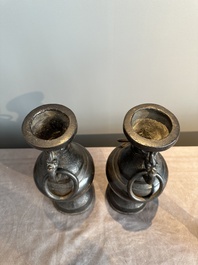 A pair of Chinese bronze vases with 'dragon' handles, Yuan/Ming
