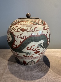 A Chinese Swatow green- and red-enamelled 'dragon' jar and a pair of covered bowls, Ming