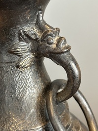 A pair of Chinese bronze vases with 'dragon' handles, Yuan/Ming