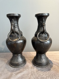 A pair of Chinese bronze vases with 'dragon' handles, Yuan/Ming