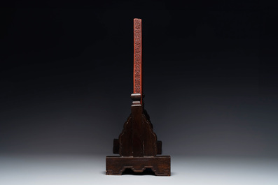 A rectangular Chinese carved red lacquer 'dragon' table screen, later wooden stand, Qianlong