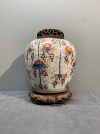 A pair of Chinese Imari-style 'grapevine' jars with wooden covers and stands, Kangxi