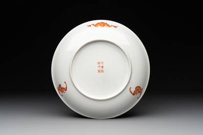 A Chinese famille rose yellow-ground plate and a pair of roosters, 20th C.