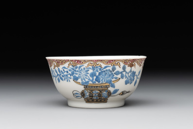 A Chinese gilt-decorated blue- and-puce-enamelled 'flower basket' cup and saucer, Qianlong
