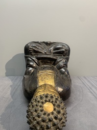 A large Chinese lacquered and gilt bronze Buddha, 17th C.
