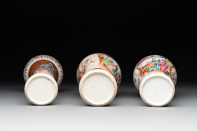 A Chinese famille rose 'mandarin subject' garniture of three vases, Qianlong