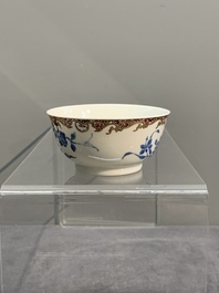 A Chinese gilt-decorated blue- and-puce-enamelled 'flower basket' cup and saucer, Qianlong