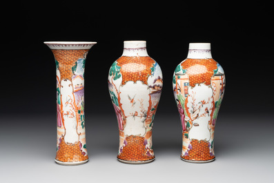 A Chinese famille rose 'mandarin subject' garniture of three vases, Qianlong