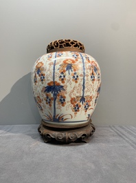 A pair of Chinese Imari-style 'grapevine' jars with wooden covers and stands, Kangxi