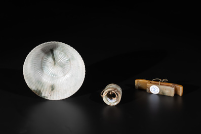 A Chinese jade 'chrysanthemum' bowl, an archer's ring and a belt hook, Ming/Qing