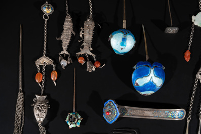 A collection of Chinese silver jewellery, some pieces adorned with enamel and precious stones, 19/20th C.