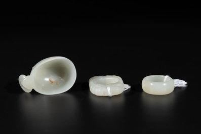A Chinese white jade cup and two rings, Qing