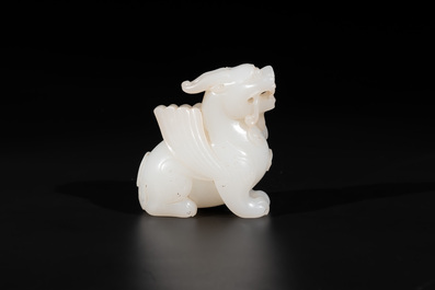 A Chinese white jade carving of a mythic animal, 19/20th C.