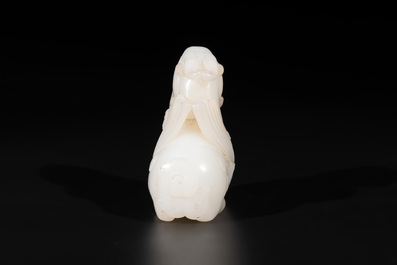 A Chinese white jade carving of a mythic animal, 19/20th C.