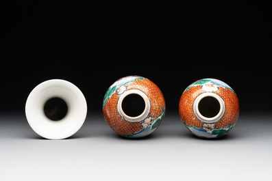 A Chinese famille rose 'mandarin subject' garniture of three vases, Qianlong