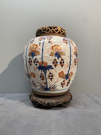 A pair of Chinese Imari-style 'grapevine' jars with wooden covers and stands, Kangxi