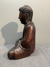 A gilt and lacquered wooden Buddha, Vietnam, 19th C.