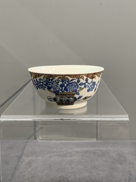 A Chinese gilt-decorated blue- and-puce-enamelled 'flower basket' cup and saucer, Qianlong
