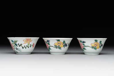 Three Chinese famille rose 'birds and flowers' cups and saucers, Yongzheng