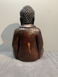 A gilt and lacquered wooden Buddha, Vietnam, 19th C.