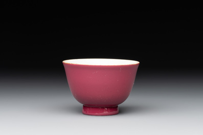 A fine Chinese ruby-ground famille rose 'magnolia' cup, Qianlong mark and of the period
