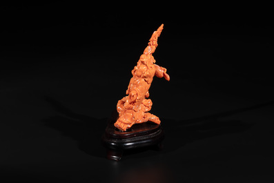 A Chinese red coral 'Sanxing' group on wooden stand, 19/20th C.