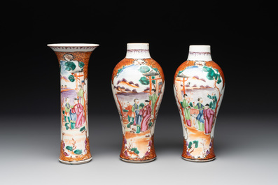 A Chinese famille rose 'mandarin subject' garniture of three vases, Qianlong