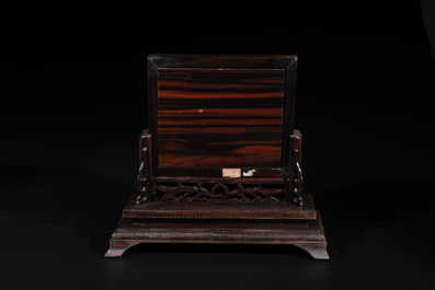 A Chinese silver-inlaid hardwood table screen with a red coral carving of a flower basket, 19/20th C.