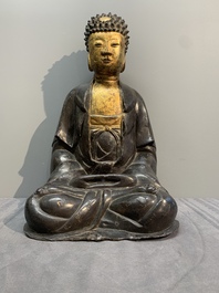 A large Chinese lacquered and gilt bronze Buddha, 17th C.