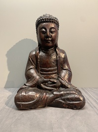 A gilt and lacquered wooden Buddha, Vietnam, 19th C.