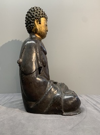 A large Chinese lacquered and gilt bronze Buddha, 17th C.