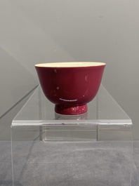 A fine Chinese ruby-ground famille rose 'magnolia' cup, Qianlong mark and of the period