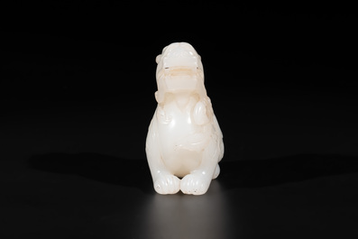 A Chinese white jade carving of a mythic animal, 19/20th C.